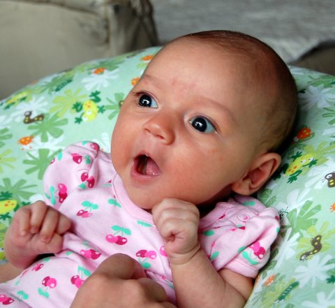 Nice try, Mom - I’m not smiling just because you tickle me!