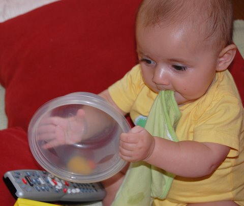Eating a washcloth, banging a bowl, and kicking a remote - a perfect birthday celebration!