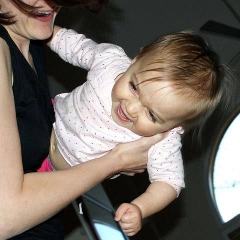 Playing “airplane” with Mom!