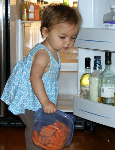 Helping to clean the fridge.