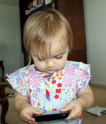 Playing Dad’s shiny new phone…