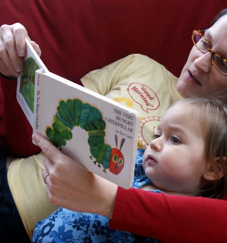 Cuddling with Mom and a favorite book.
